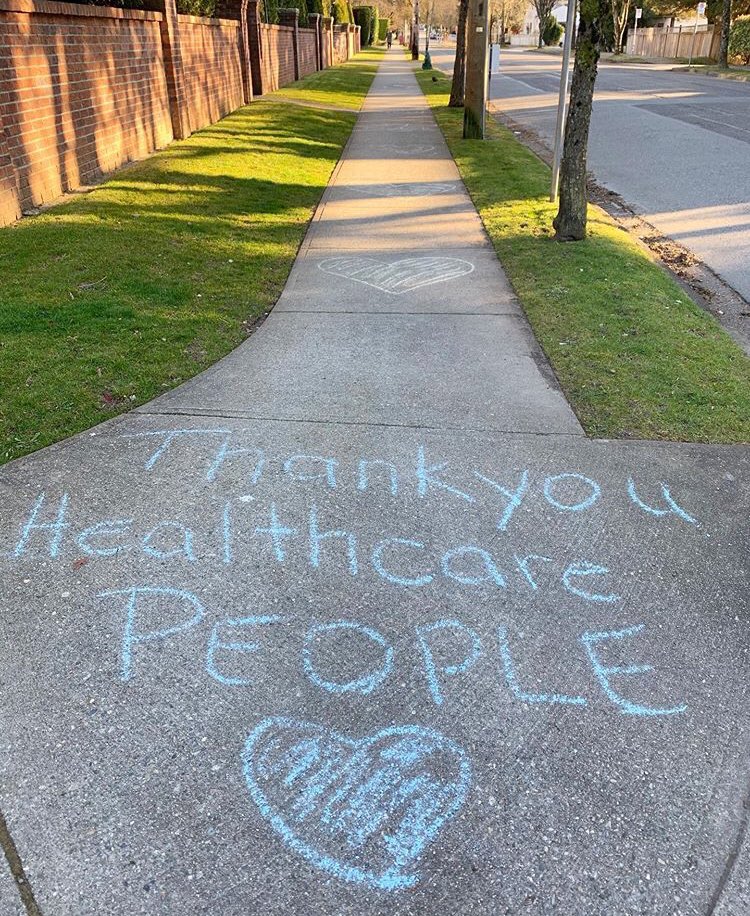 Thank you messages for the healthcare workers written on the sidewalk during COVID-19