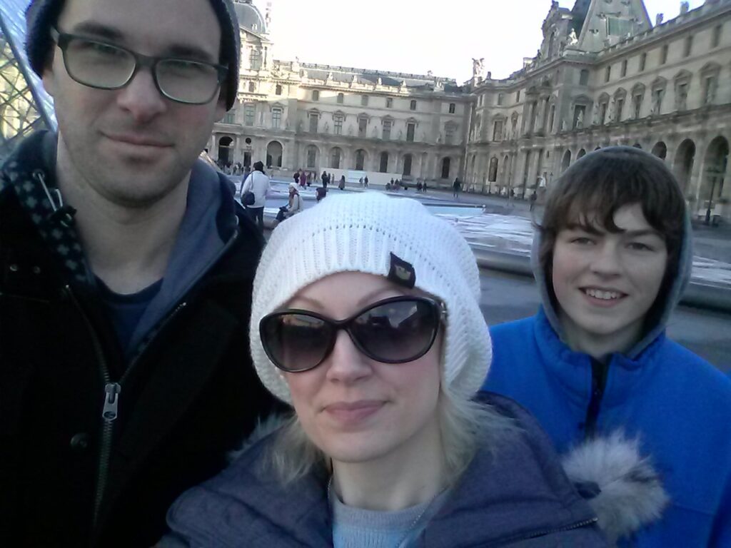 Kristen Hovet with her partner and son during a trip to Paris